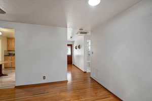 Hall featuring light wood finished floors and baseboards