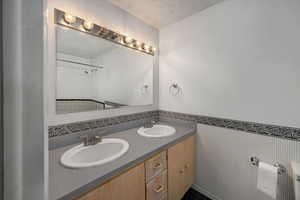 Full bath featuring double vanity