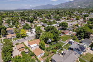 Aerial view of residential area featuring a mountainous background