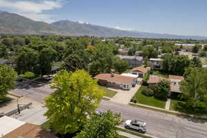 Aerial perspective of suburban area featuring a mountain backdrop