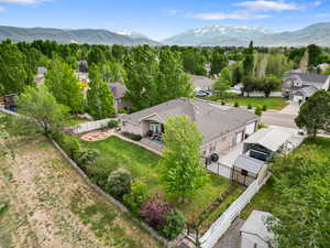 Aerial perspective of suburban area featuring a mountainous background