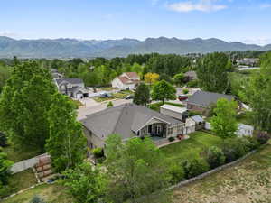 Aerial perspective of suburban area featuring a mountain backdrop