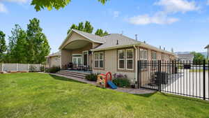 Back of house with a patio area, stucco siding, and a shingled roof