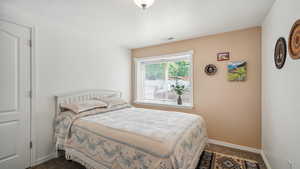 Carpeted bedroom with baseboards