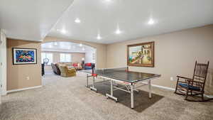 Playroom with carpet floors, arched walkways, baseboards, and recessed lighting