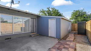 Walk out to patio with separate laundry room.