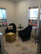 Living area featuring light floors