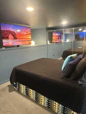 Carpeted bedroom featuring recessed lighting
