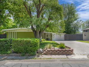 Mid-century home featuring ample driveway space