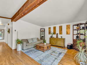 Living area featuring original hardwood floors