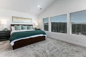 Bedroom with carpet flooring, baseboards, high vaulted ceiling, and recessed lighting