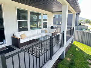 View of patio / terrace with an outdoor living space and a mountain view