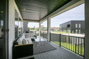 Wooden deck featuring an outdoor living space