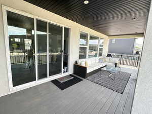Wooden deck featuring an outdoor living space