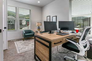 Home office featuring carpet flooring, baseboards, and recessed lighting