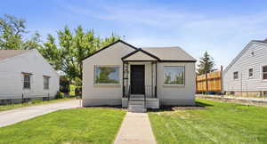 Bungalow-style home featuring stucco siding