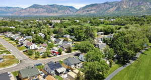 Aerial perspective of suburban area with a mountain backdrop