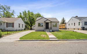 Bungalow-style home featuring concrete driveway
