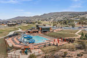 View of swimming pool with a mountain view and a residential view
