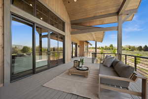Wooden terrace with an outdoor hangout area