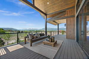 Deck with a mountain view and an outdoor hangout area