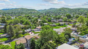 Aerial perspective of suburban area with a mountain backdrop