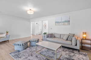 Living area featuring wood finished floors and baseboards
