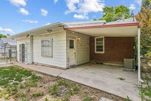 View of front of home featuring central air condition unit