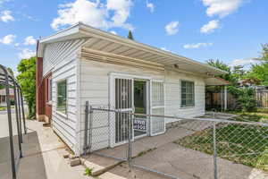 Back of house with a gate