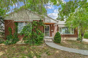 View of front of house featuring brick siding