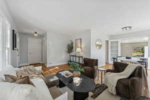 Living room featuring wood finished floors and baseboards