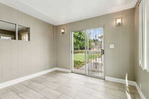 Unfurnished room with baseboards