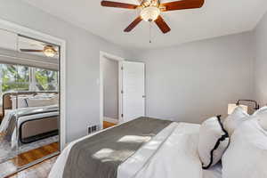 Bedroom featuring wood finished floors and ceiling fan