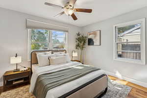 Bedroom featuring wood finished floors and ceiling fan