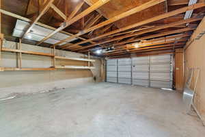 Garage featuring a garage door opener