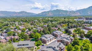 Aerial view of residential area featuring a mountainous background