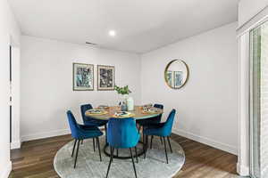 Dining space featuring baseboards and wood finished floors