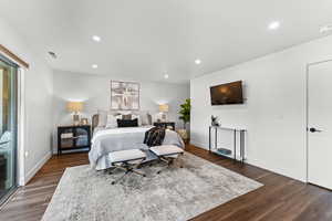 Master Bedroom with dark wood-type flooring, recessed lighting, and baseboards