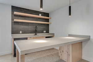 Optional Bar with a sink, decorative light fixtures, and wine cooler