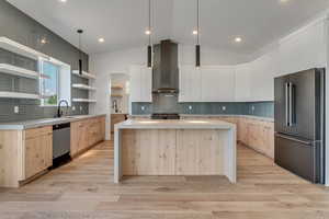 Kitchen with high quality appliance package, and vaulted ceiling