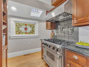 Every square inch of this home showcases thoughtful detail, from intricate woodwork to period accents. Even the kitchen delights, with charming stained glass windows that add character and warmth while you cook.