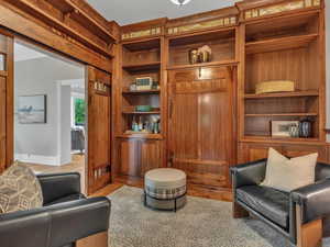 Wrapped in rich, original wood trim and anchored by beautifully preserved parquet floors, this studio exudes historic charm and craftsmanship. The hidden Murphy bed adds flexibility, easily transforming the space into a fifth bedroom or a welcoming guest