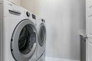 Laundry room featuring washing machine and dryer