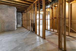 Miscellaneous room with unfinished concrete flooring