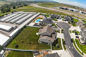 Aerial view of residential area featuring a pool