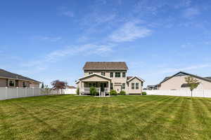 Rear view of property featuring stucco siding
