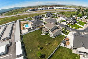 Aerial overview of property's location featuring nearby suburban area and mountains