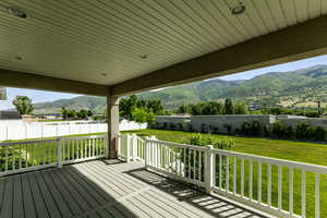 Wooden deck featuring a mountain view