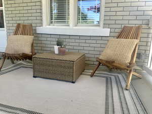 Sitting room featuring brick wall