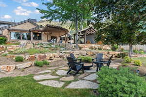 large flat yard with fire pit area